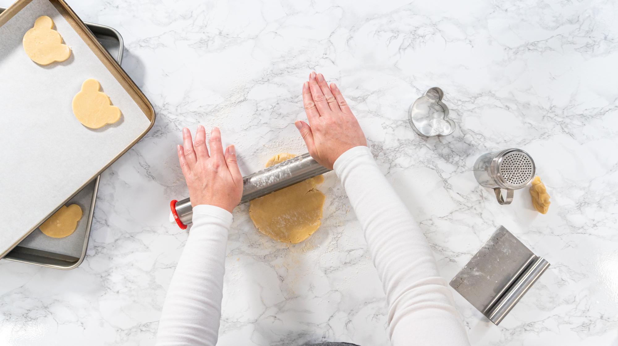 hands preparing pastry on marble