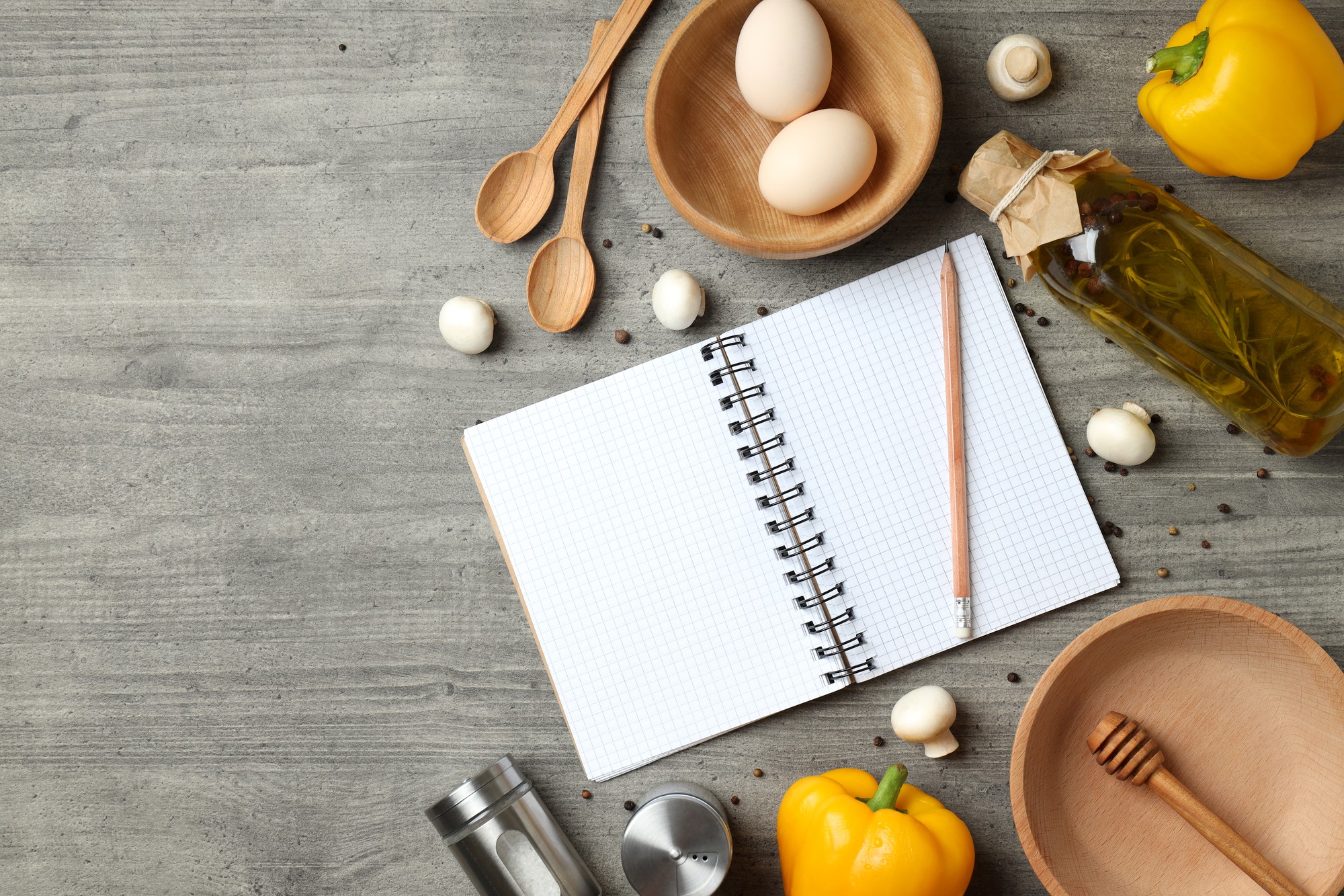 flat lay of culinary tools and notebook